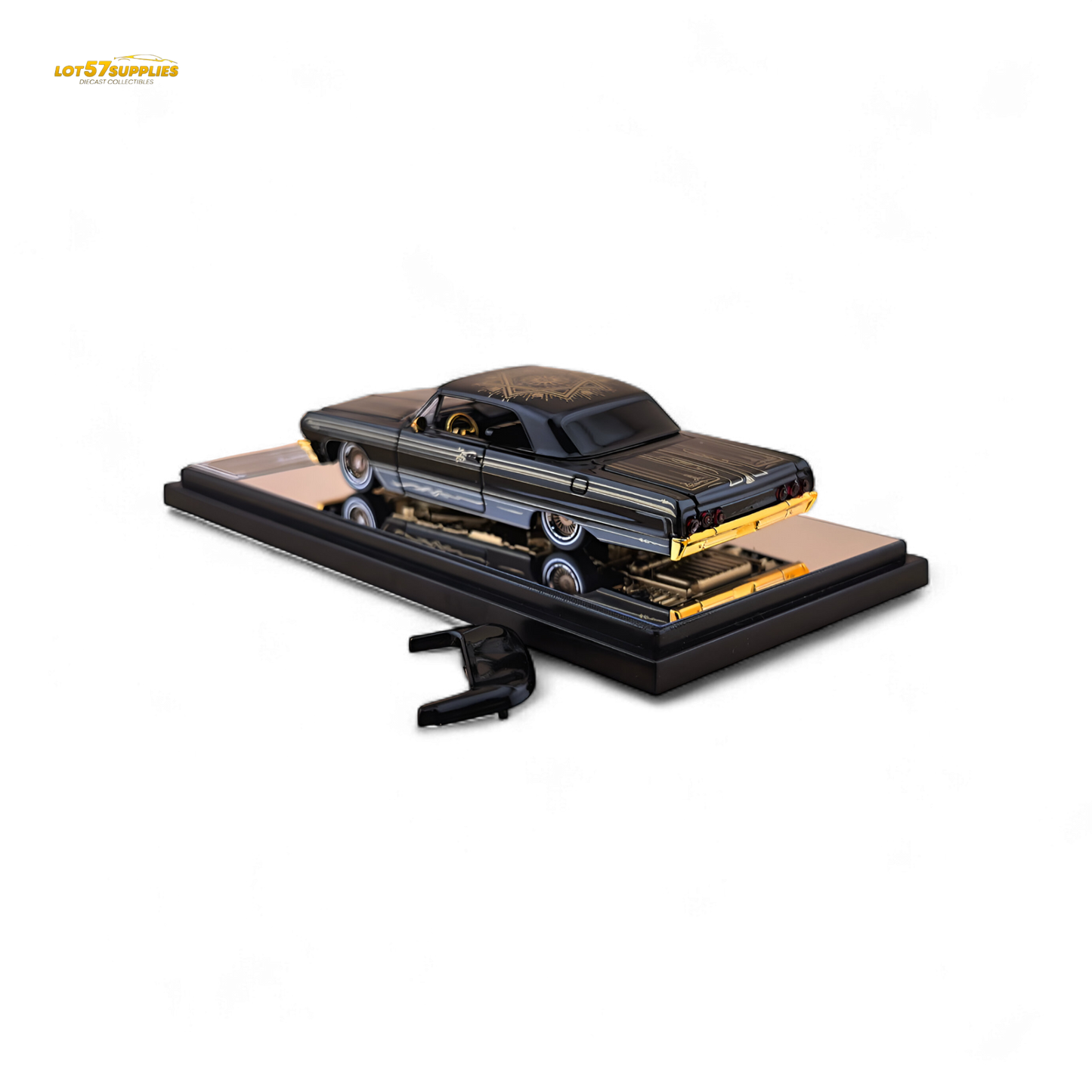 Detailed image of a 1:64 Chevrolet Impala lowrider diecast model with black and gold livery by Lot57Supplies Diecast Shop.