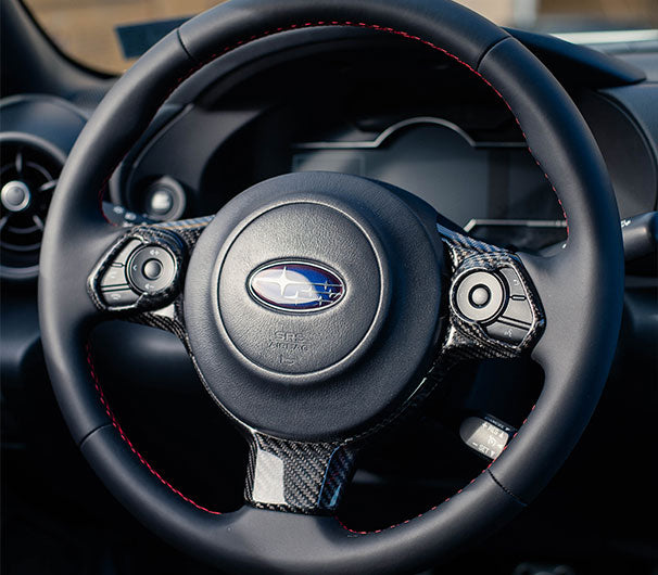 OLM LE dry carbon fiber steering wheel trim for Subaru BRZ and Toyota GR86