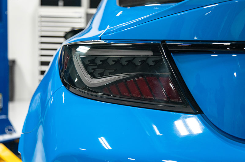 OLM Scythe LED tail lights in smoke and white for 2022+ Subaru BRZ and Toyota GR86