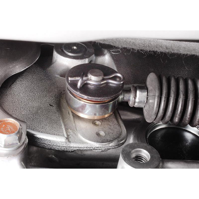 PERRIN brass shifter bushing kit for Subaru WRX, Crosstrek, Forester, Legacy, and Outback, showing metal bushings on a display.