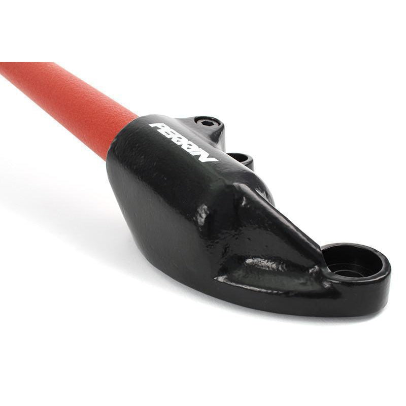 JDMuscle Perrin front strut tower brace for Subaru WRX STI, Crosstrek, Legacy GT, and Forester XT, black metal design.