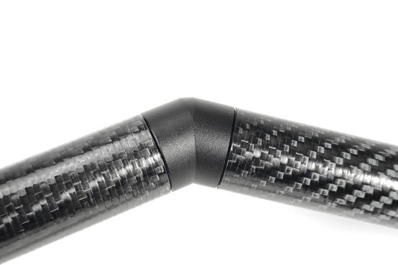 Perrin universal carbon fiber strut brace with billet feet, designed for improved chassis stiffness and performance in JDM vehicles.