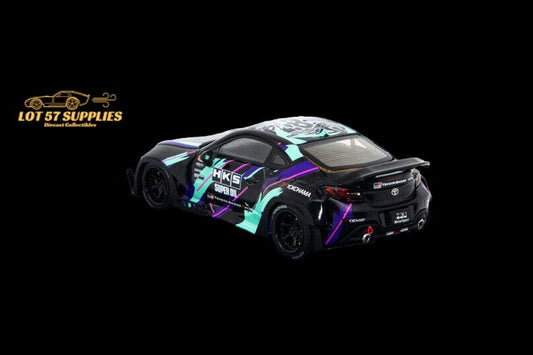Detailed 1:64 scale Toyota GR86 diecast model featuring Fuji Rocket Bunny Pandem HKS livery with vibrant colors and racing decals.