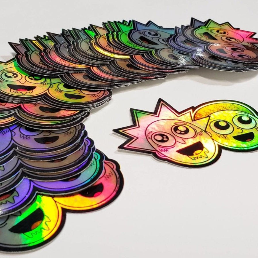 Holographic Rick and Morty anime sticker by Evergreen Kings featuring colorful character art on a shiny surface.