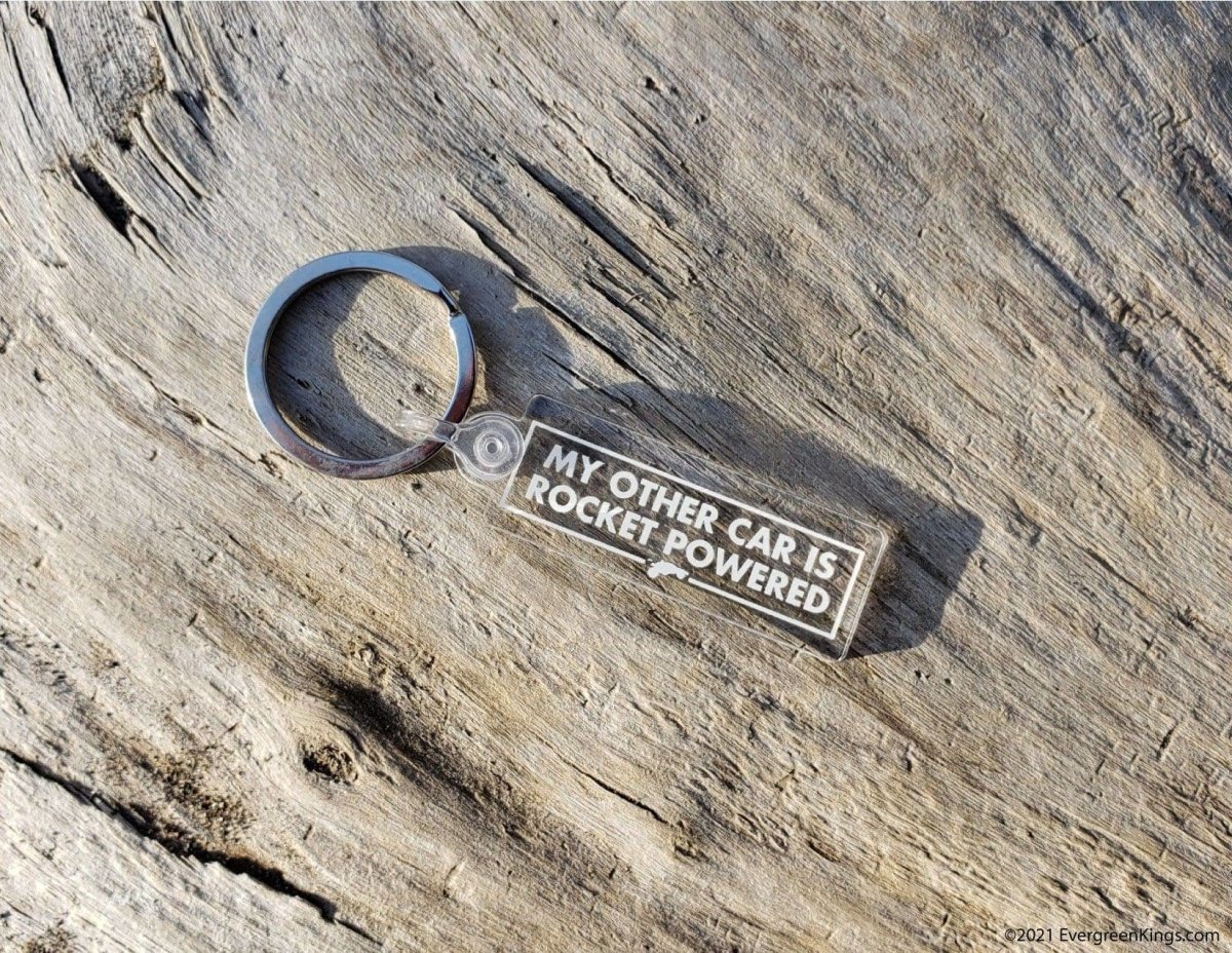Rocket-powered car keychain by Evergreen Kings featuring a detailed miniature car with rocket design on a keyring.