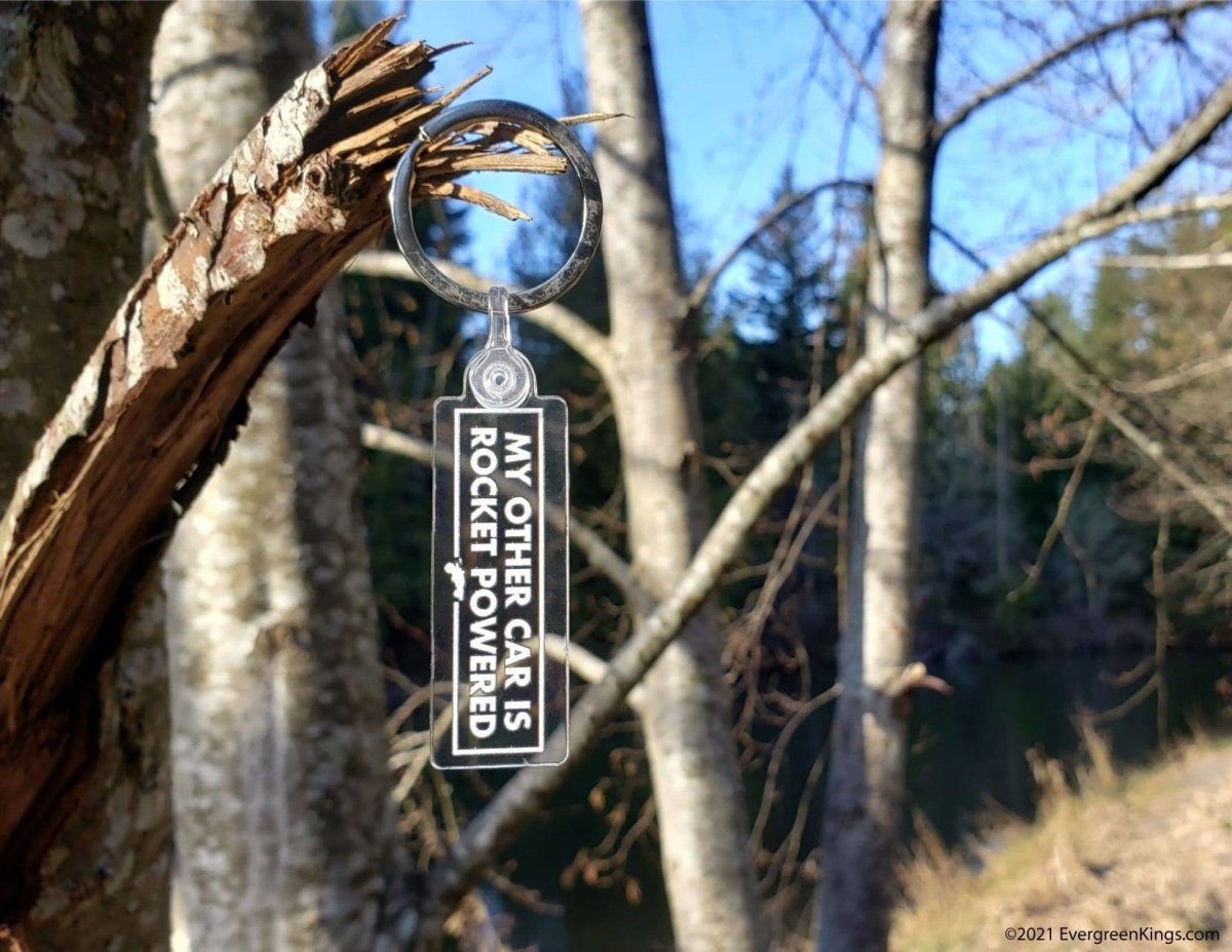 Rocket-powered car keychain by Evergreen Kings featuring a miniature car with rocket design on a keyring.