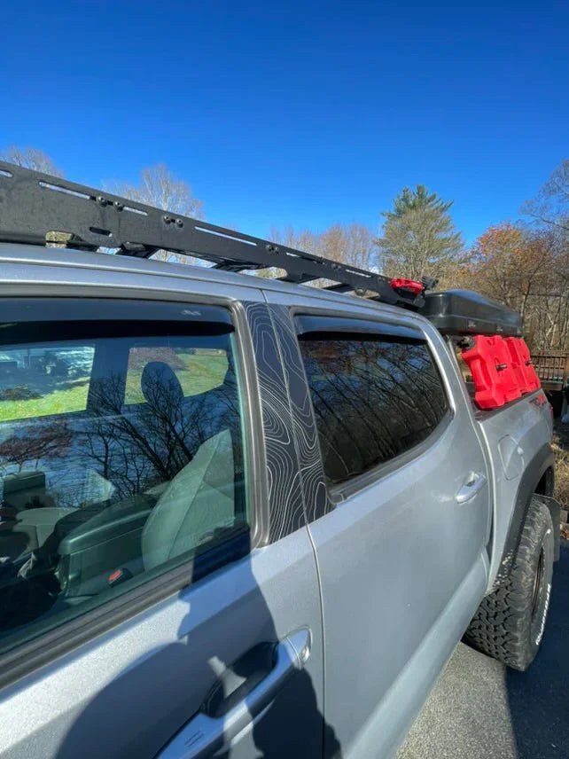 Vinyl Topo B Pillar overlays on a 2016-2023 Tacoma Double Cab exterior, showing black decorative accessory on vehicle pillars