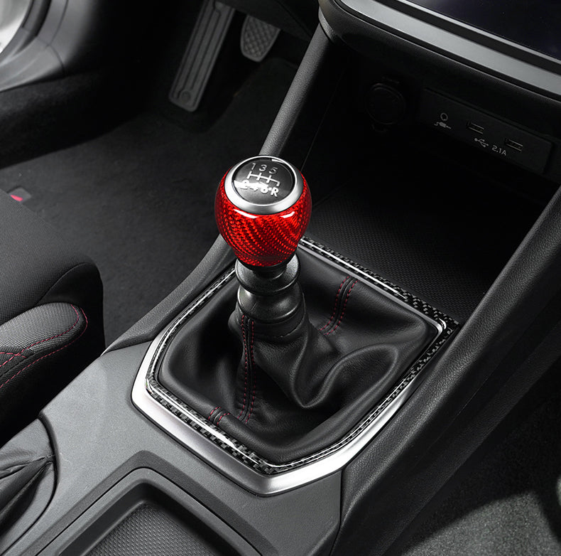 JDMuscle 22-25 WRX dry carbon fiber shift knob surround trim kit, sleek and lightweight for sporty interior enhancement.