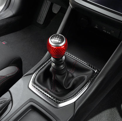 JDMuscle 22-25 WRX dry carbon fiber shift knob surround trim kit, sleek and lightweight for sporty interior enhancement.