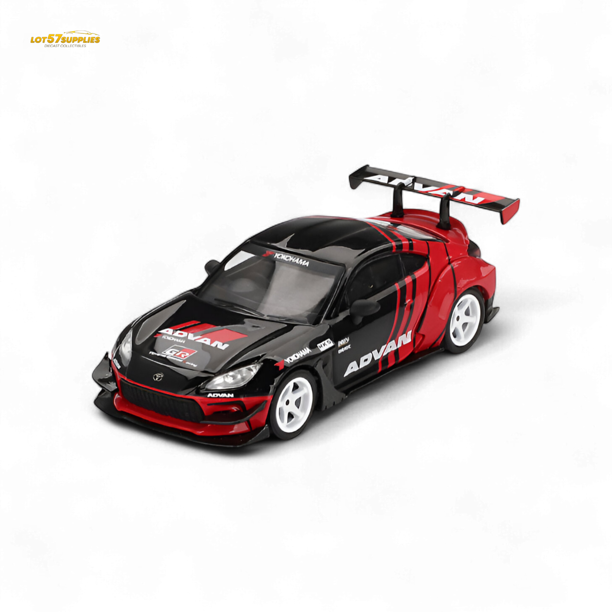 Mini-GT Toyota GR86 diecast model featuring HKS and ADVAN decals, detailed 1:64 scale replica of the Toyota sports car.