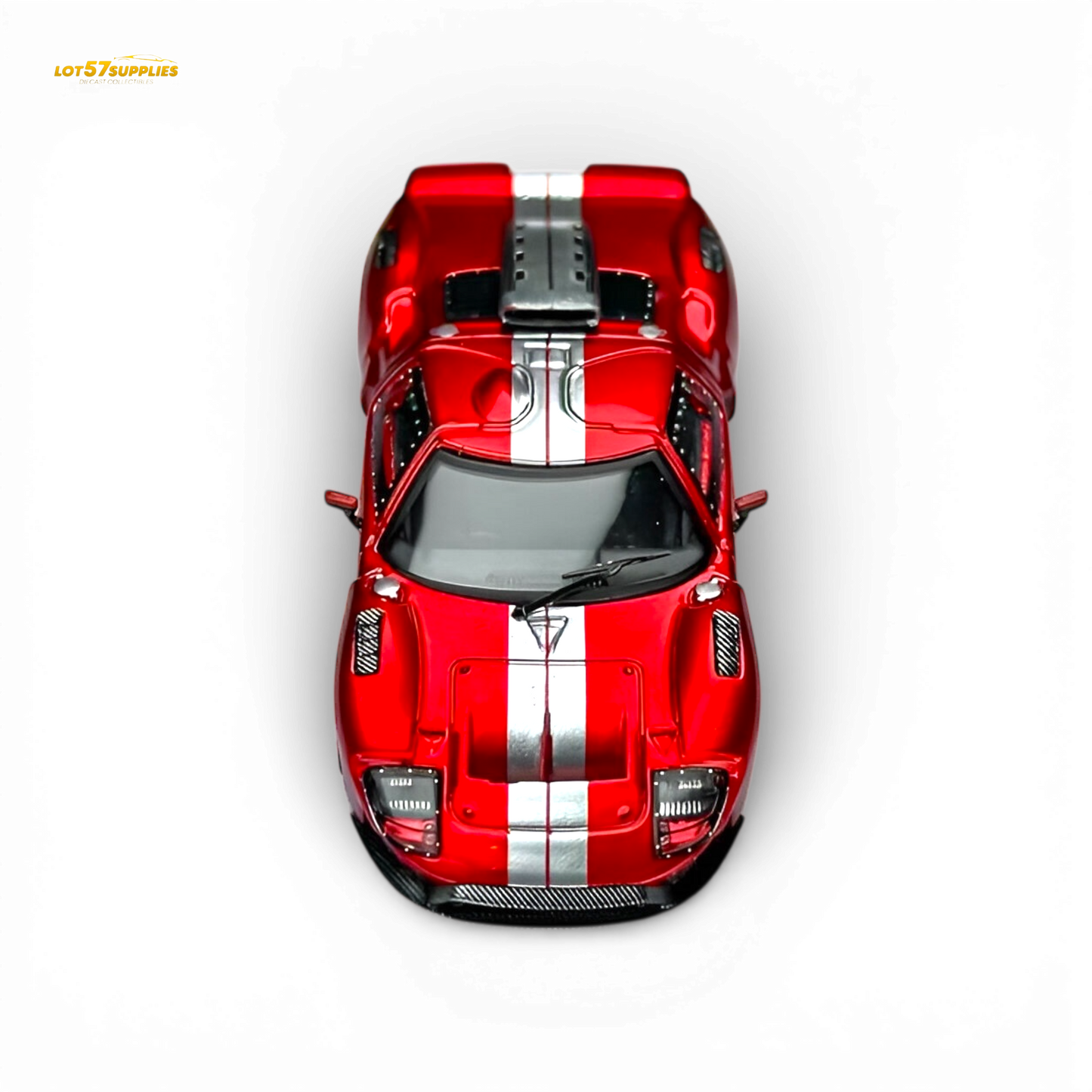 Red Ford GT40 diecast model by Rhino Model RM, 1:64 scale, transparent red finish, detailed miniature car.