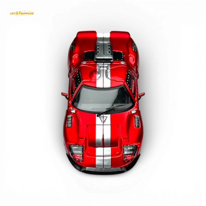 Red Ford GT40 diecast model by Rhino Model RM, 1:64 scale, transparent red finish, detailed miniature car.