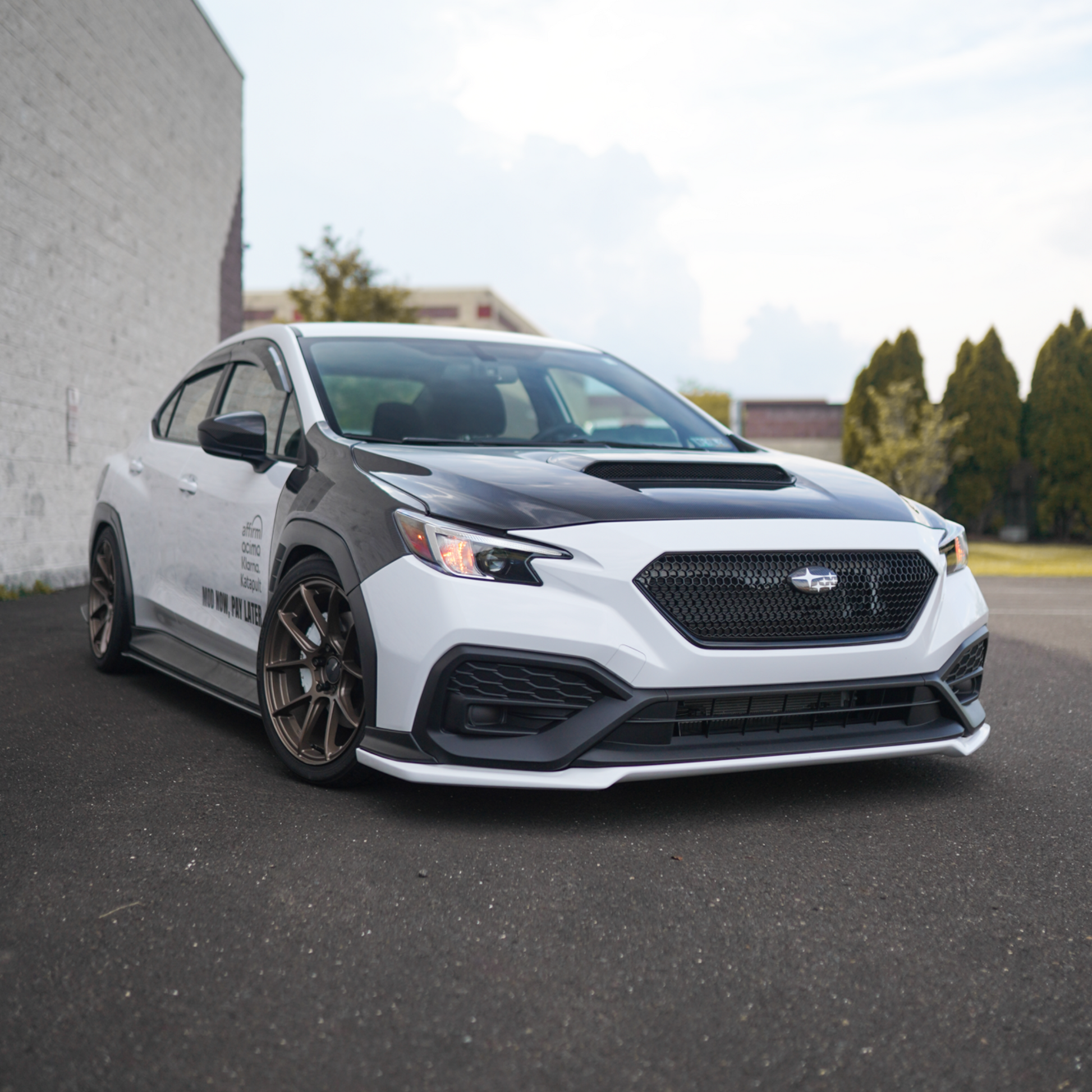 JDMuscle carbon fiber hood for 2022-2025 Subaru WRX, OEM+ style 2-piece hood with a sleek, lightweight design and sporty appearance.