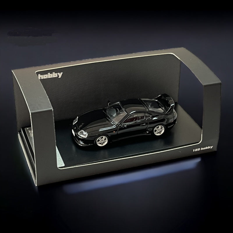Black Toyota Supra JZA80Z diecast model in 1:64 scale by 123 Hobby, featuring detailed design and realistic appearance.