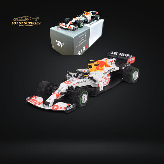 Red Bull Mini-GT diecast model of Sergio Pérez RB16B #11 in red, detailed 1:64 scale car with racing livery and sponsor decals.