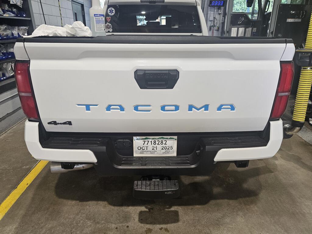 Vinyl TACOMA Tailgate Inlay Letters for 2024+ Tacoma truck exterior, featuring StickerFab branding and bold lettering design.