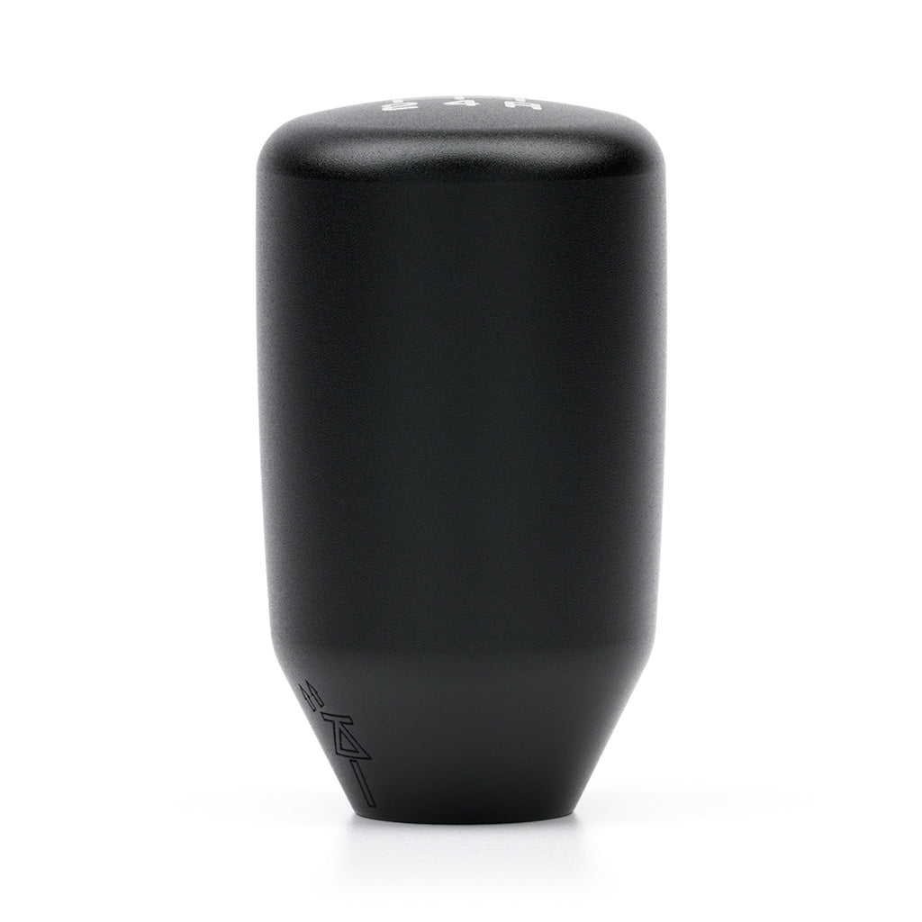 A satin black Prestige Auto Lab ACUITY ESCO-T5 5-speed shift knob with M10 x 1.5 threading, showcasing its sleek design.