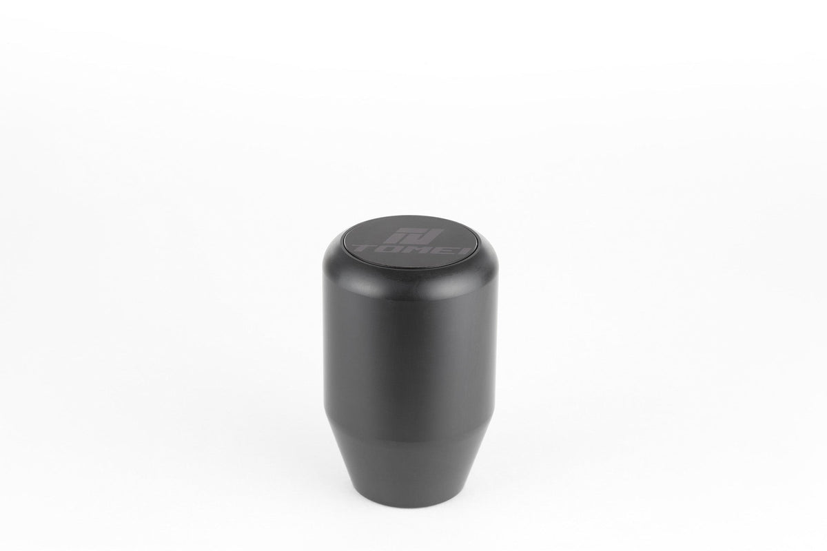 FR SPORT Tomei Duracon manual transmission shift knob with ergonomic design and textured surface for comfortable gear shifting.