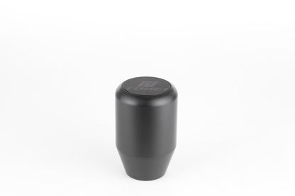 FR SPORT Tomei Duracon manual transmission shift knob with ergonomic design and textured surface for comfortable gear shifting.