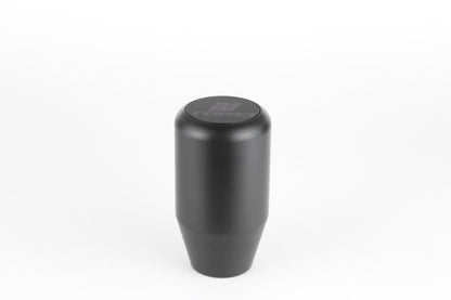 FR SPORT Tomei Duracon manual transmission shift knob with textured surface, mounted on a gear shift lever.