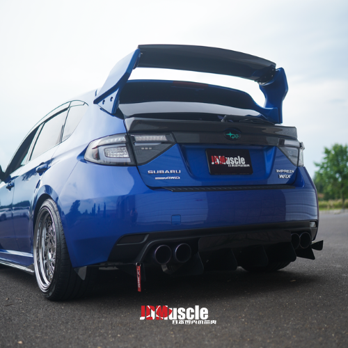 JDMuscle VS Style spoiler with brake lights for 08-14 Subaru WRX/STI, ABS, paint-matched, partial carbon fiber finish.