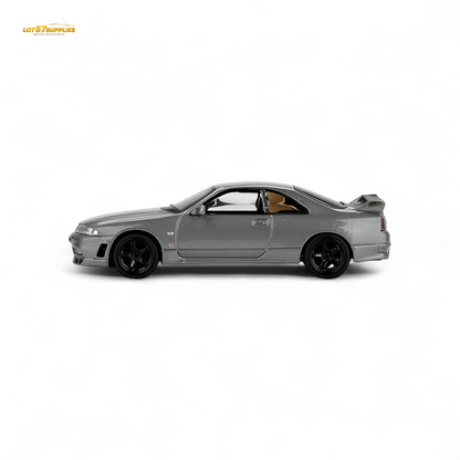 Mini GT Nissan Skyline GT-R NISMO BCNR33 CRS Version diecast car in dark metal gray, 1:64 scale, detailed model.