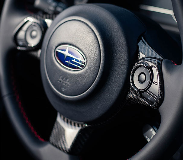 OLM LE dry carbon fiber steering wheel trim for Subaru BRZ and Toyota GR86