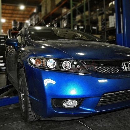 Honda Civic Sedan 2006-2011 Spec-D dual halo LED projector headlights in black, featuring modern design and bright illumination.