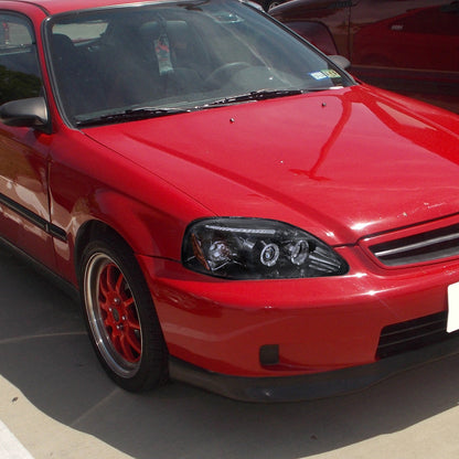 Honda Civic 1999-2000 Spec-D dual halo LED projector headlights in black smoked finish, featuring modern LED lighting.