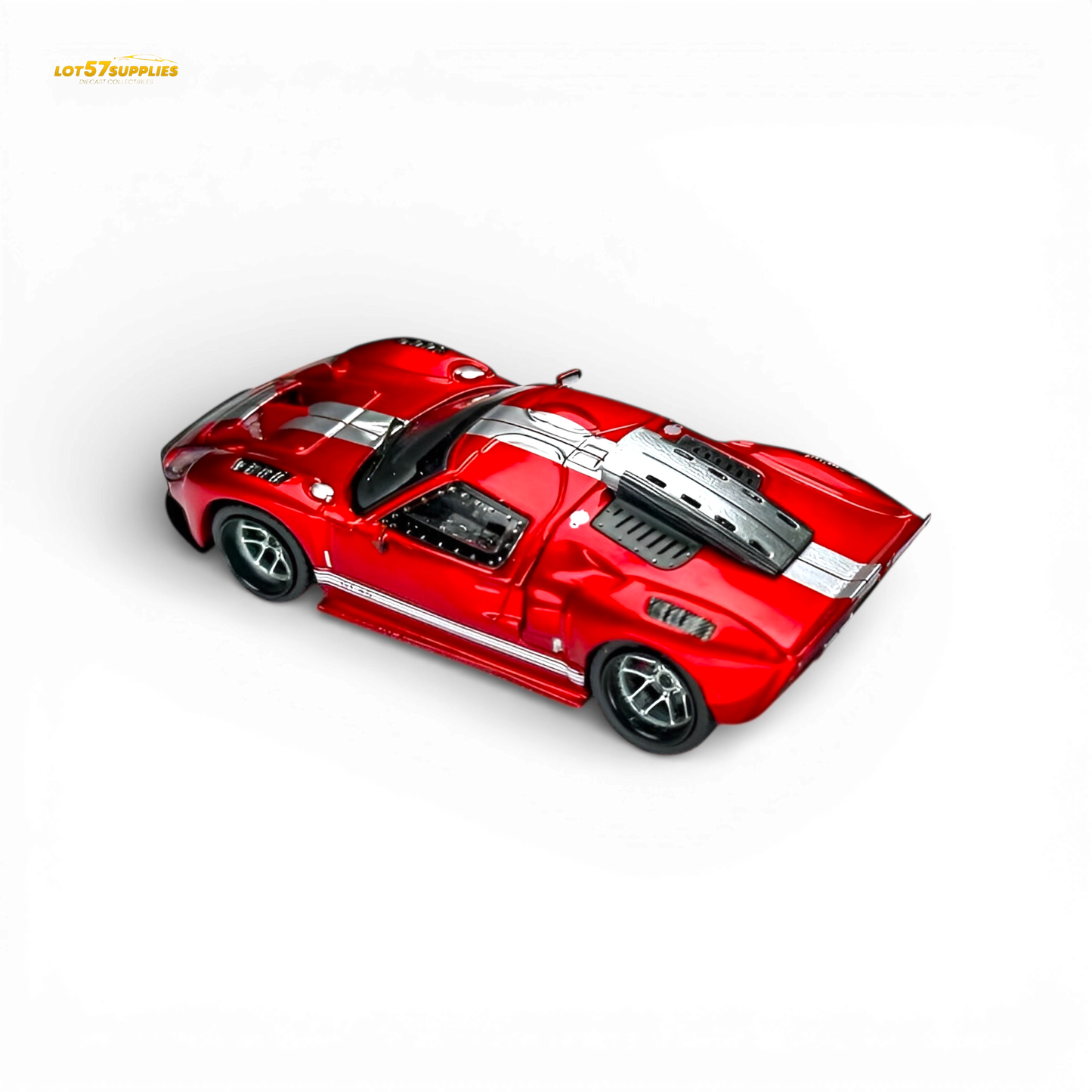 Rhino Model RM Ford GT40 diecast car in transparent red, 1:64 scale, showcasing detailed Ford sports car design.
