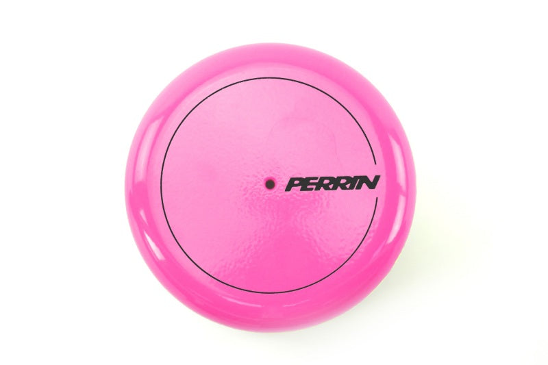 JDMuscle Perrin hyper pink oil filter cover for Subaru WRX, BRZ, and Toyota GR86 engine oil caps on a car engine.