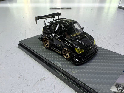 Miniature black and gold Subaru Impreza WRX STI diecast model by YM Model, detailed 1:64 scale, showcasing sporty design.