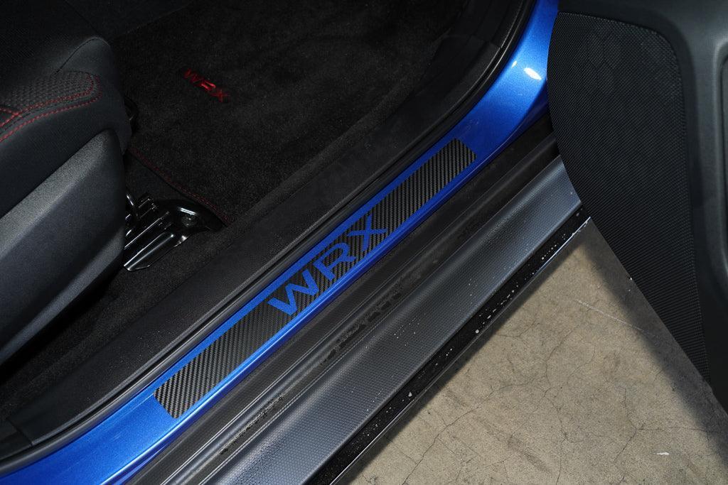 3D carbon door sill accent overlay for 2015-2025 Subaru WRX/STI interior by StickerFab, showcasing sleek design on vehicle door sill.