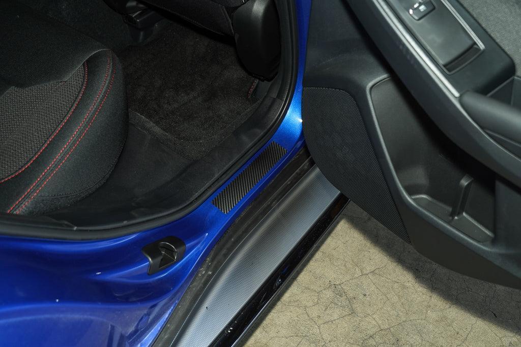 3D Carbon Door Sill Accent Overlay for 2015-2025 WRX and STI interior, StickerFab brand, shown installed on vehicle door sill.