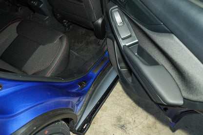 3D carbon door sill accent overlay for 2015-2025 Subaru WRX/STI interior, StickerFab brand, shown installed on car door sill.