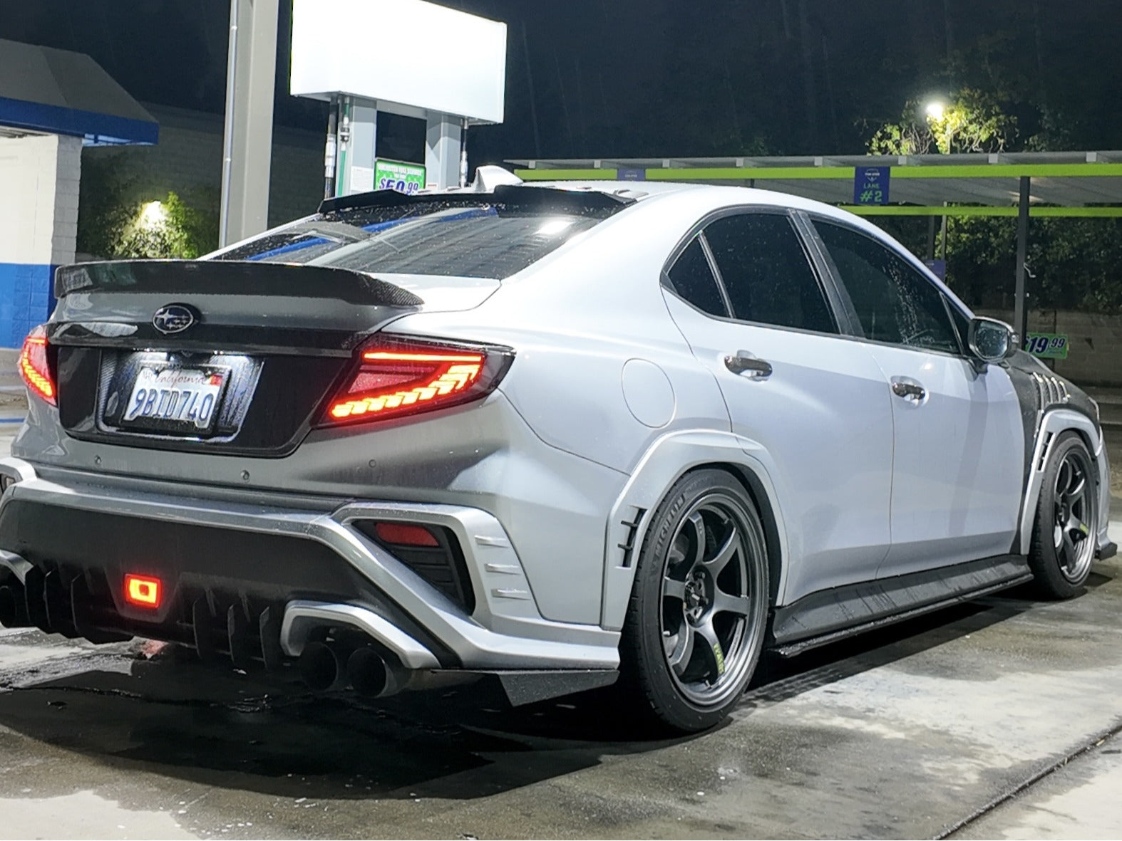 OLM Phantom-Spec LED taillights with clear lens and red optic for 2022+ Subaru WRX, showing the tail light assembly on the vehicle.