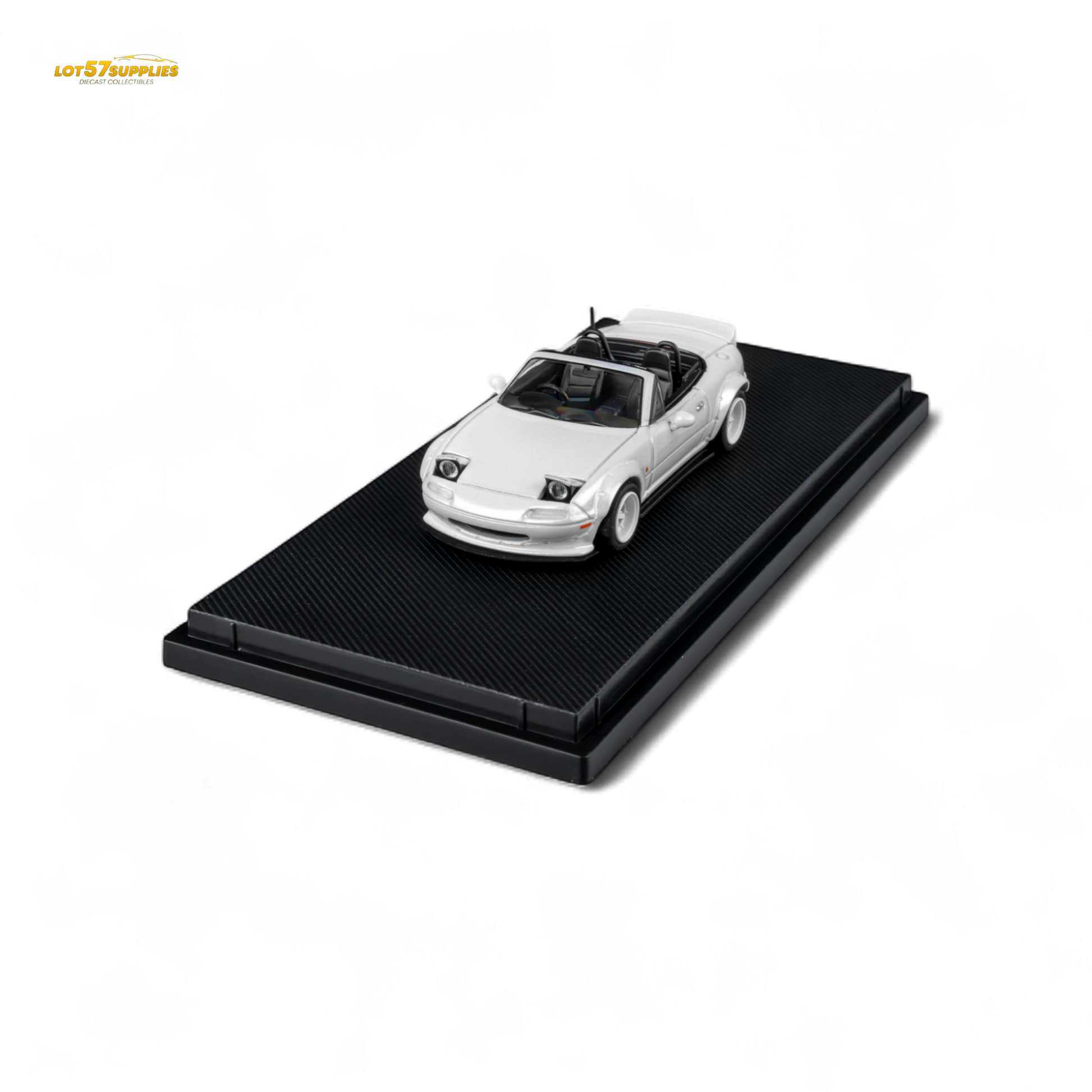 Metallic white Mazda Microturbo Custom MX5 Rocket Bunny diecast model in 1:64 scale, detailed miniature car with sporty design.