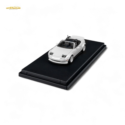 Metallic white Mazda Microturbo Custom MX5 Rocket Bunny diecast model in 1:64 scale, detailed miniature car with sporty design.