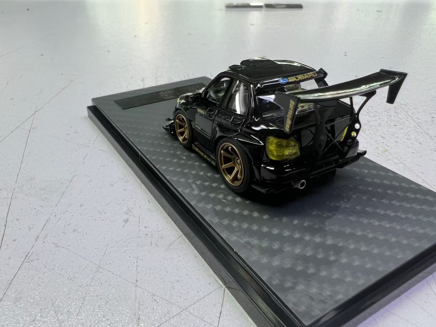 Yellow and black diecast Subaru Impreza WRX STI Voltex model car by Lot57Supplies, detailed 1:64 scale collectible.
