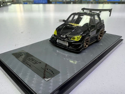 Black and gold YM Model Subaru Impreza WRX STI diecast car, 1:64 scale by Lot57Supplies Diecast Shop, detailed model vehicle.