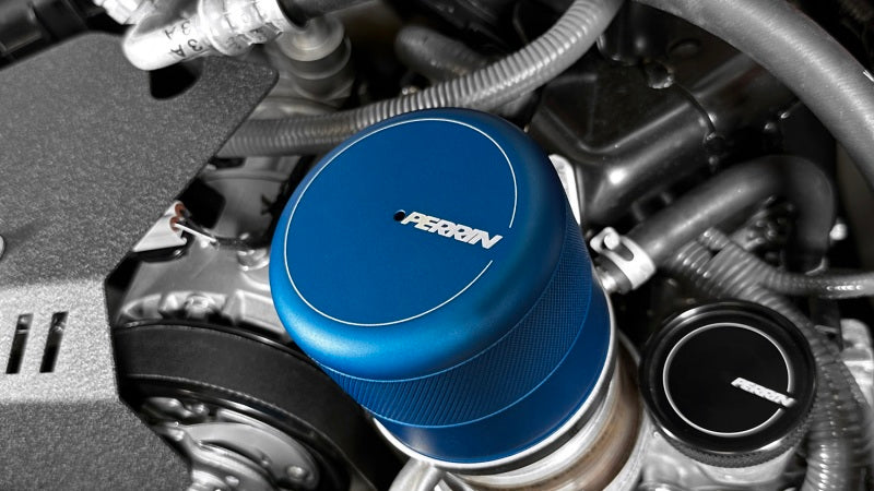 Blue PERRIN oil filter cover for WRX, BRZ, and GR86 engines by JDMuscle
