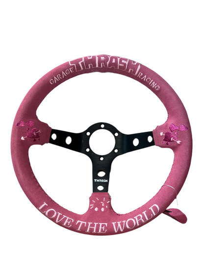 Speedzone Performance LLC Thrash Racing Steering Wheel with "Love the World" design, black and silver racing wheel for cars.