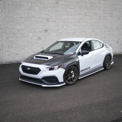 JDMuscle Tanso carbon fiber hood for Subaru WRX 22-25, OEM+ style 2-piece design with sleek finish and vent details.