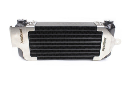 JDMuscle Perrin 02-14 WRX and 04-21 STI oil cooler kit installed with fluid cooler components in a car engine bay