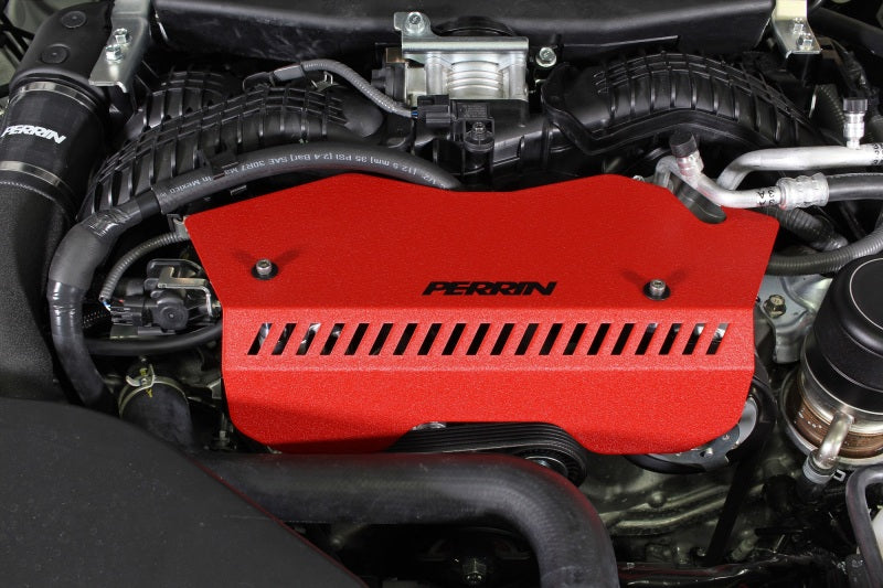 Red Perrin belt pulley cover for 2022-2025 Subaru WRX, JDMuscle branded engine accessory, shown on a car engine.