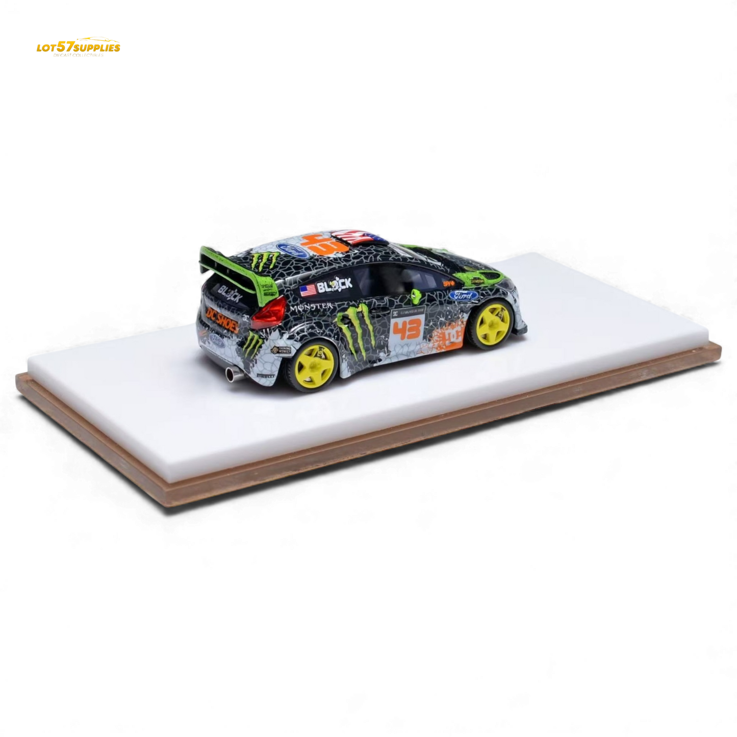 Miniature Ford Fiesta diecast model in Gymkhana livery, 1:64 scale, featuring detailed decals and vibrant racing colors.
