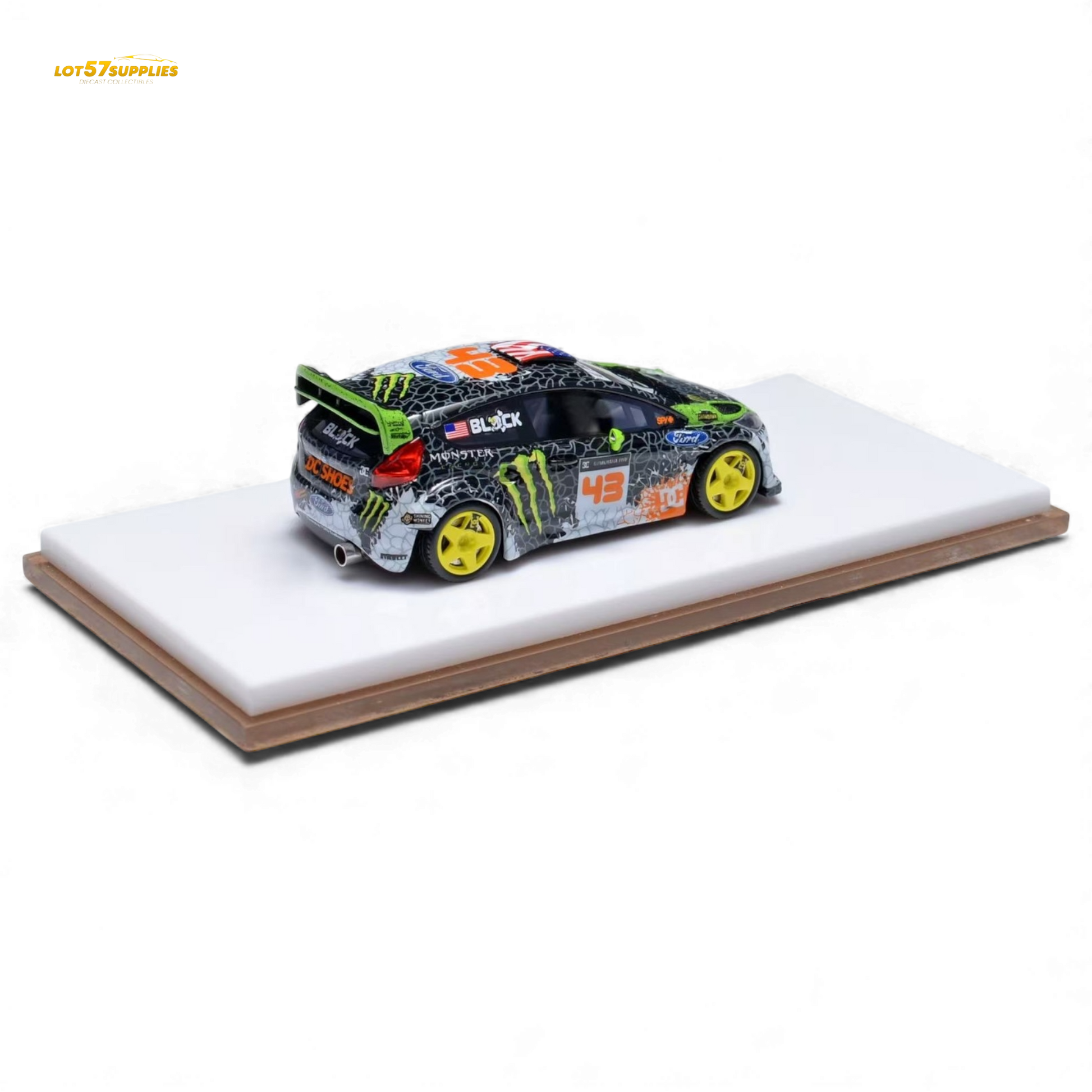 Miniature Ford Fiesta diecast model in Gymkhana livery, 1:64 scale, featuring detailed decals and vibrant racing colors.