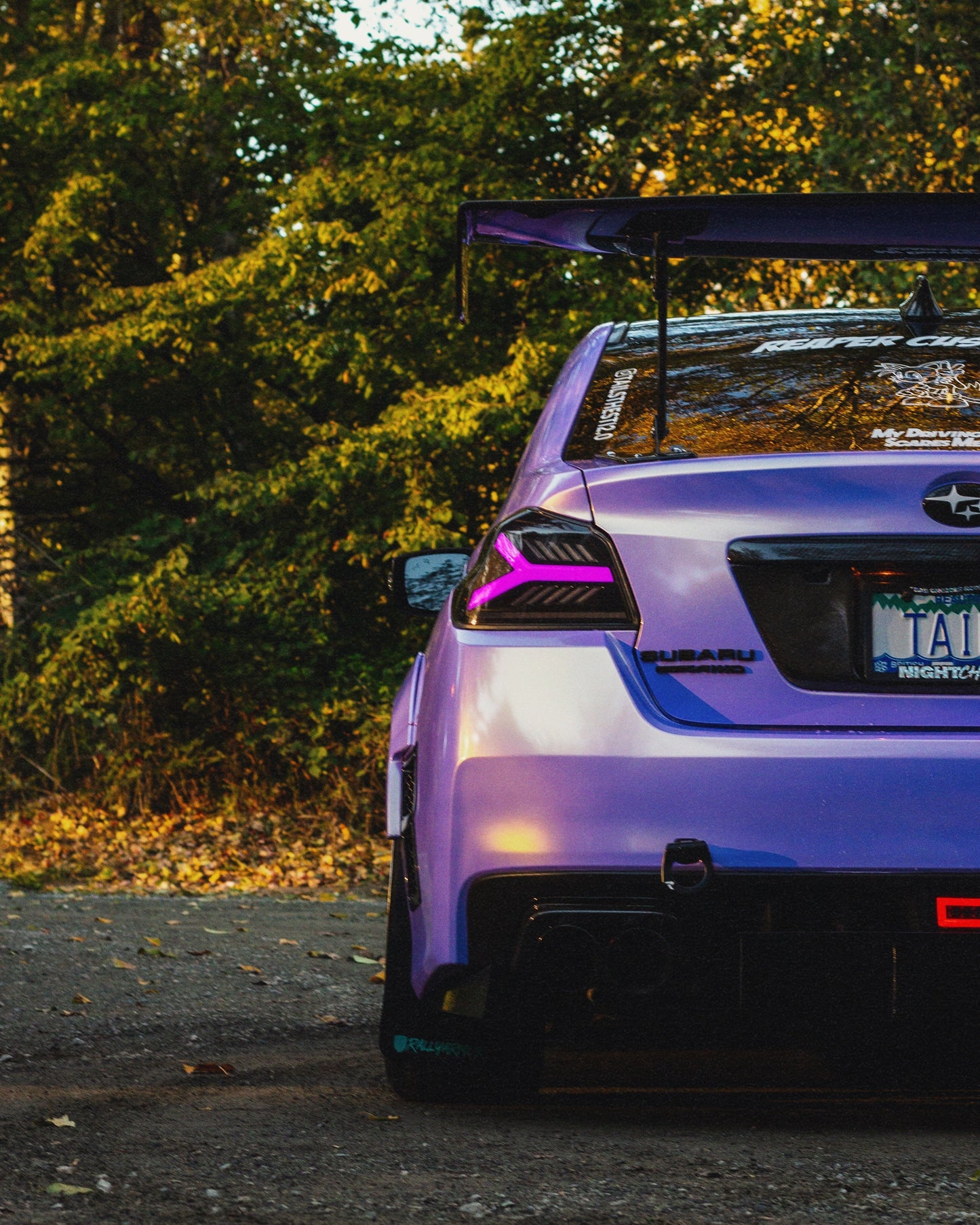 OLM Y-Spec LED taillights for 2015-2021 Subaru WRX/STI with smoke lens and RGB optic features, showcasing sleek tail light design.