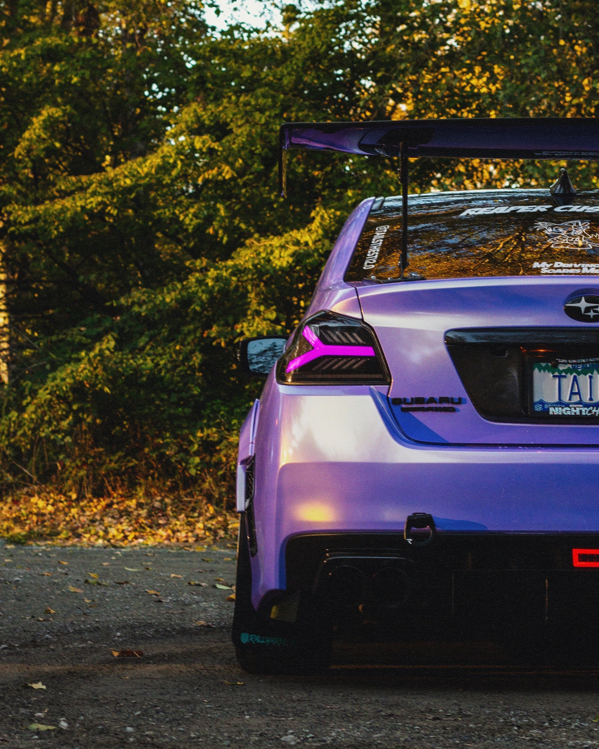 OLM Y-Spec LED taillights for 2015-2021 Subaru WRX/STI with smoke lens and RGB optic features, showcasing sleek tail light design.