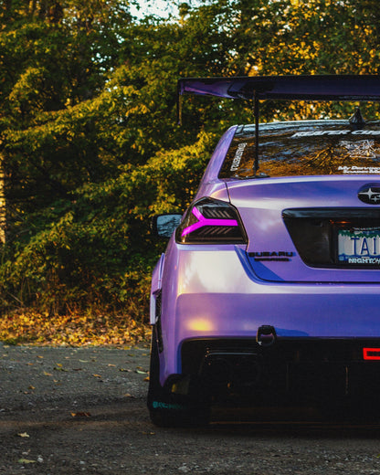 OLM Y-Spec LED taillights for 2015-2021 Subaru WRX/STI with smoke lens and RGB optic features, showcasing sleek tail light design.